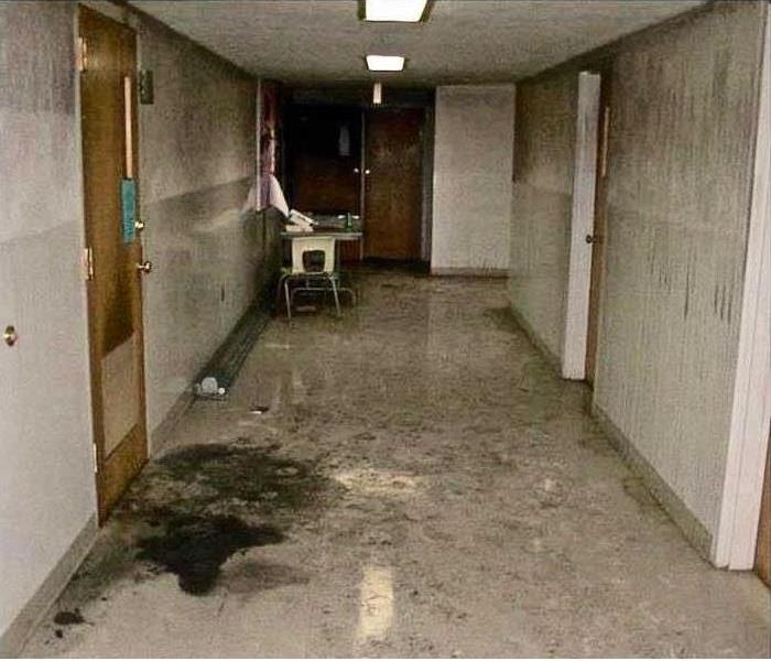 corridor in commercial building with filthy soot and smo9ke stains on all surfaces