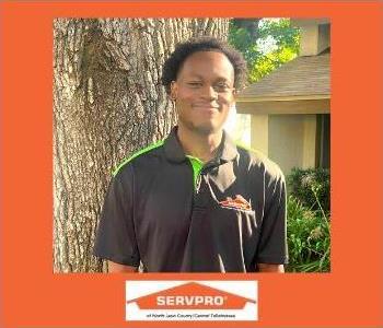 Field Technician at SERVPRO office, standing by tree