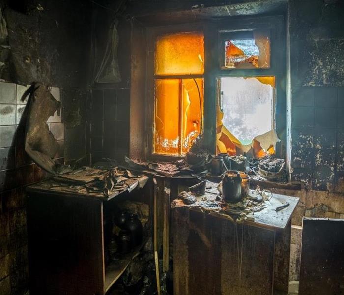 inside of house with soot and burned furniture