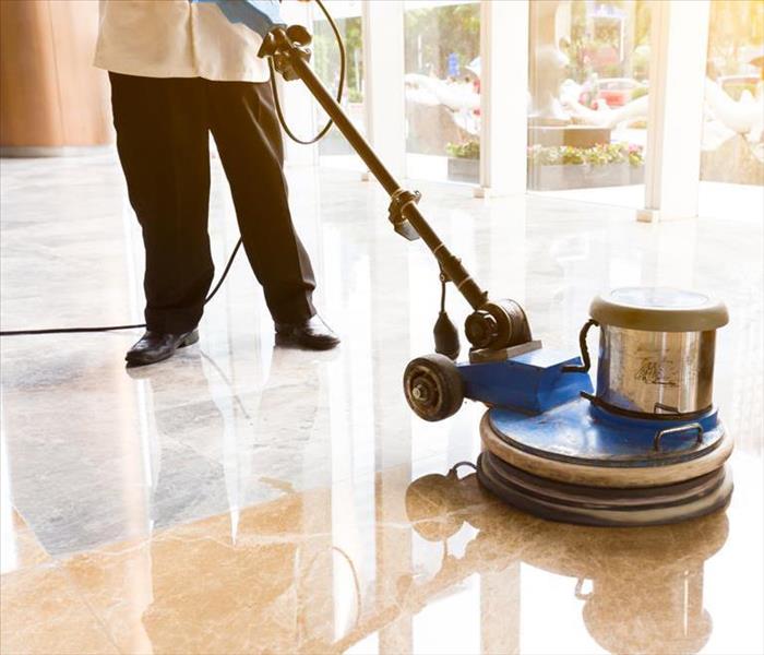 cleaning services - image of person waxing floor