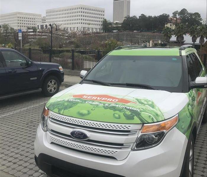 SERVPRO sales vehicle with city background